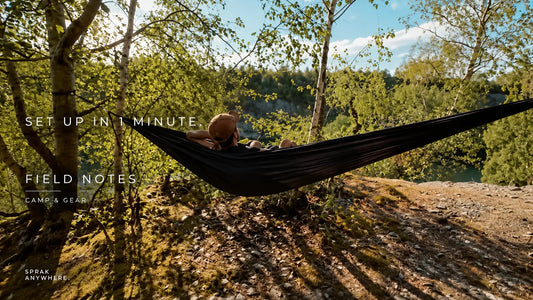 Lightweight hammock camping setup with a hammock suspended between trees